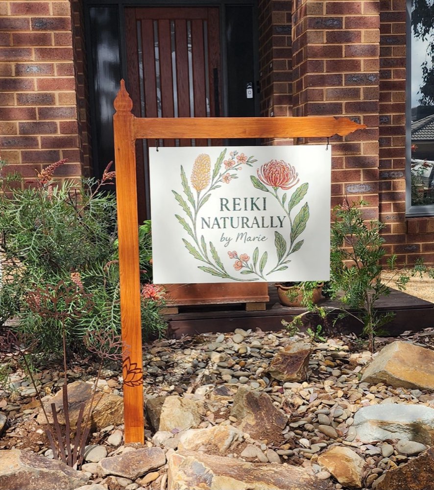The Reiki Naturally by Marie sign in the native garden out the front